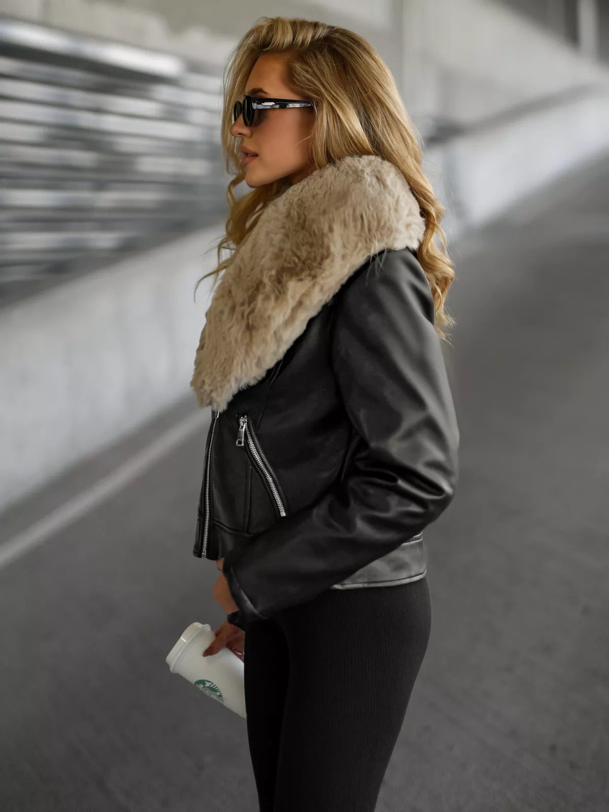Women's black leather jacket with brown fur Laser