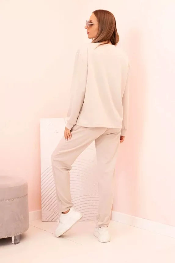 Naomi women's light brown suit.