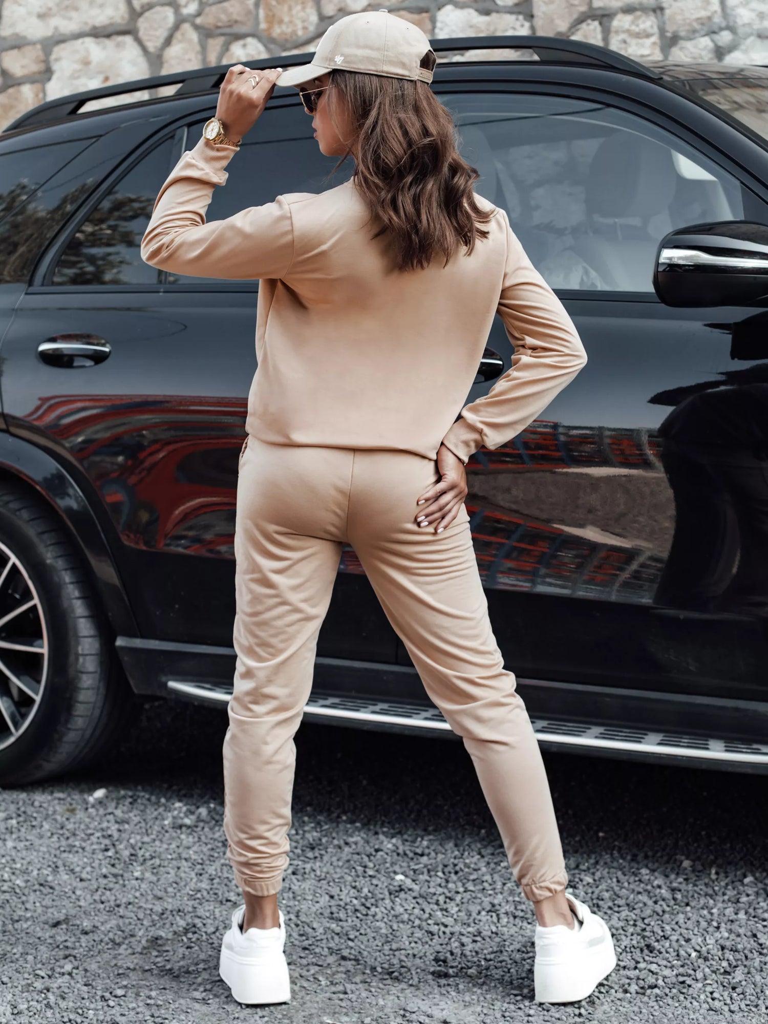 Women's light brown suit by Milin.