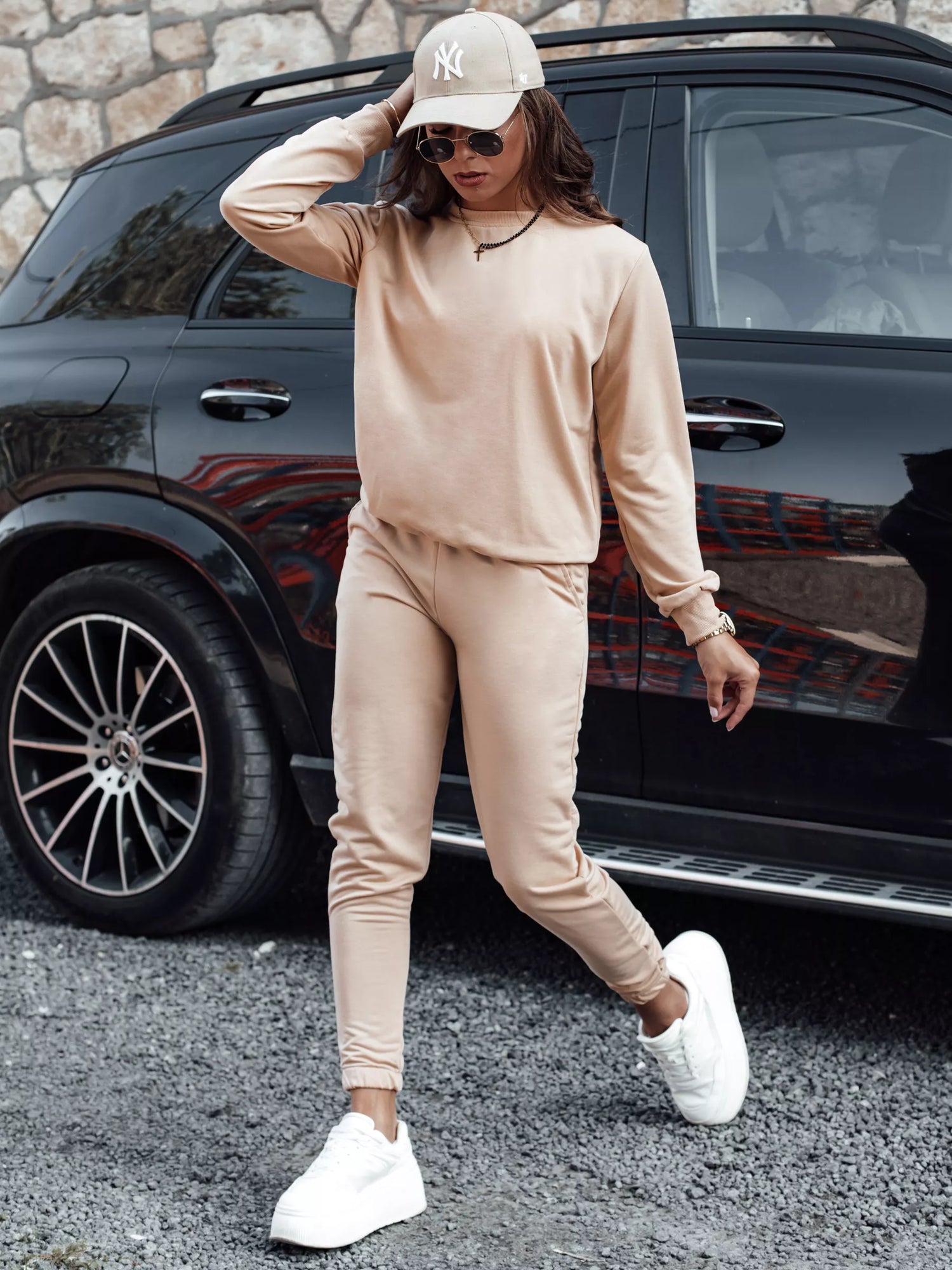 Women's light brown suit by Milin.