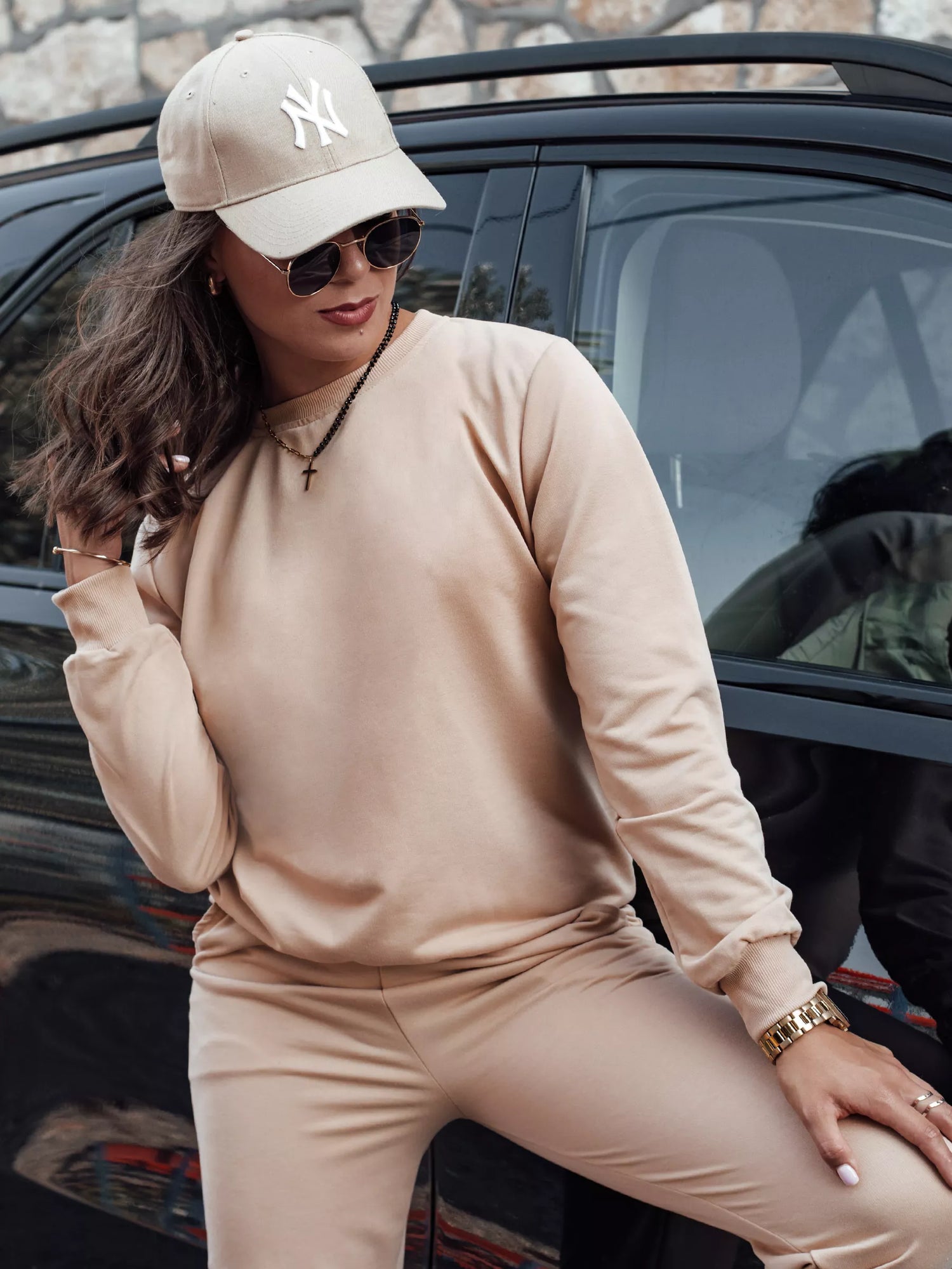 Women's light brown suit by Milin.